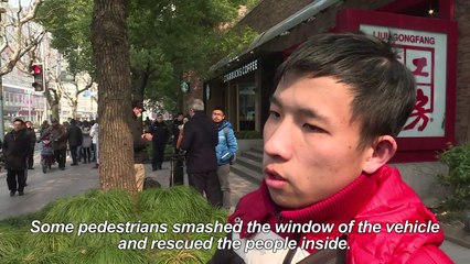 18 hurt as burning van slams into crowd in Shanghai