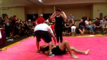 Girl taping a boy BJJ