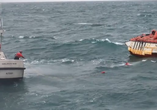 Fishermen Jump From Sinking Boat, Swim to Waiting US Coast Guard Vessel