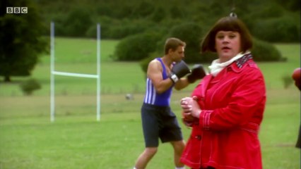 Gigglebiz Gail Force on a sport field with some boxes