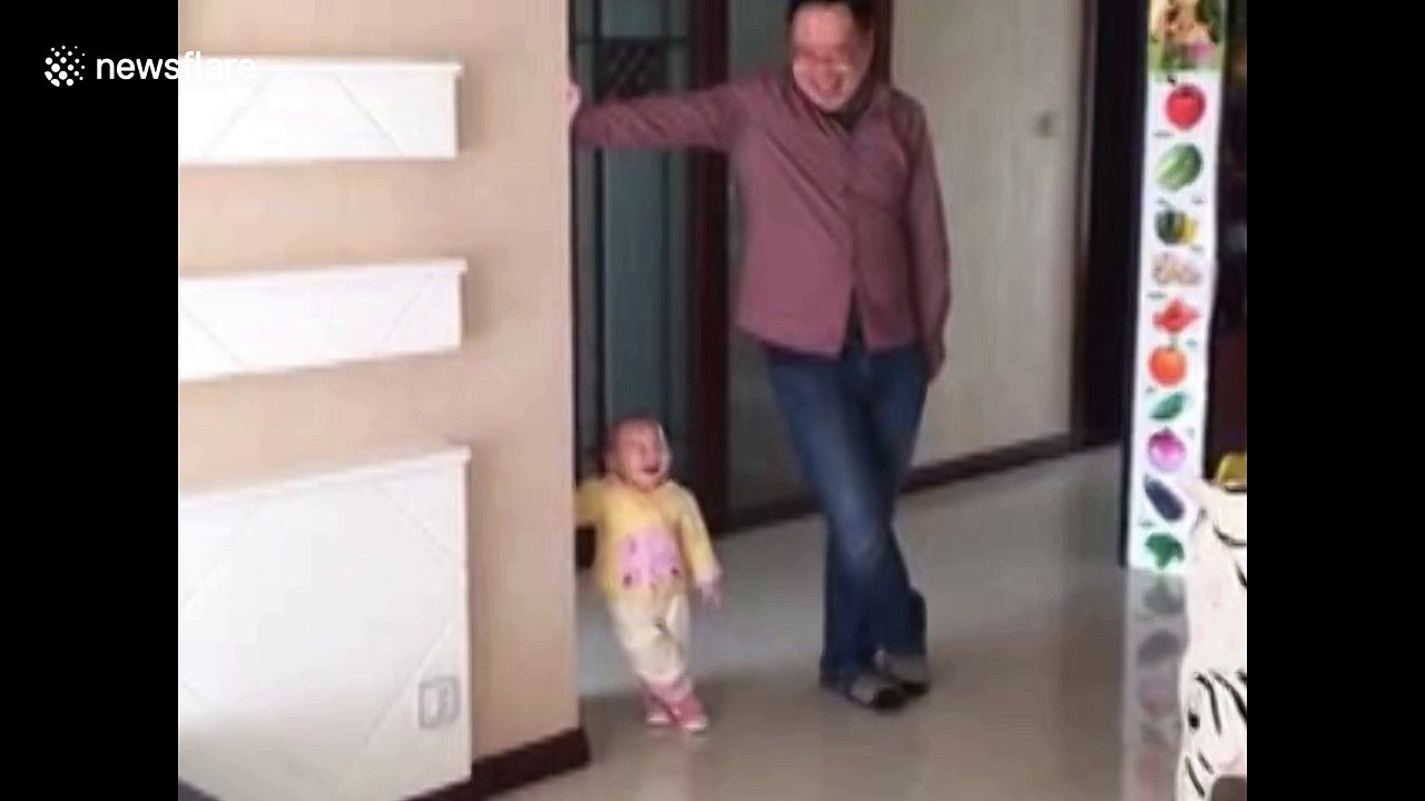 Cute toddler mimics dad's posture