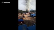 Massive explosion sends huge mushroom cloud of smoke into air at firecrackers factory
