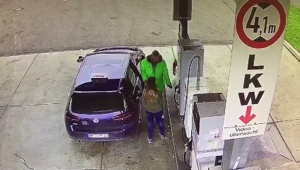 Father teaches his daughter how to refuel a car