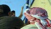عبدالله ولؤي على متن قارب شراعي قديم في مشروع البحر الأحمر