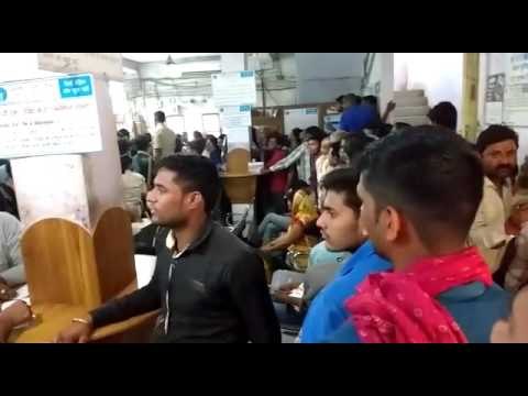 crowd outside of bank for changing rupees