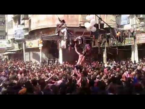 People participating in Matki Fod contest in Ganga Mela Kanpur