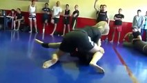 strong blonde girl beats a man in grapling