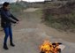 Woman Burns Hijab in Show of Solidarity With Iranian Protesters