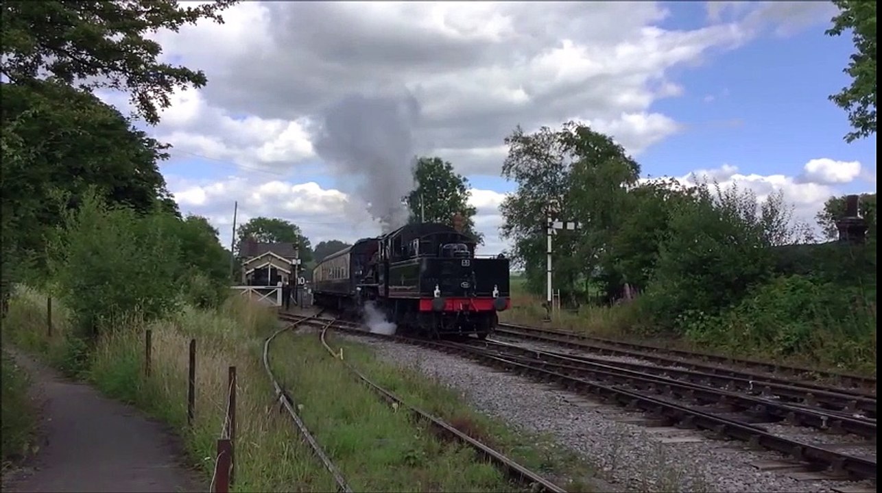 Tender Engine pulling a Train of Coaches out of the Station on British ...