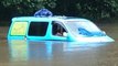 British Backpackers Wake Up to Find Van Partially Submerged by Floodwaters