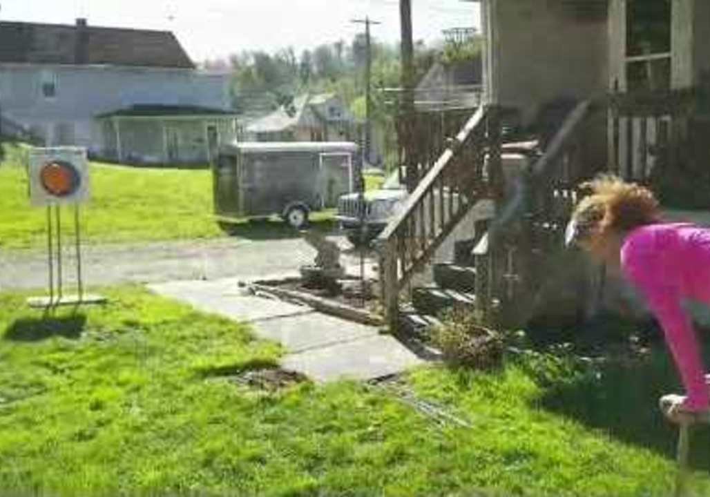 Girl Nails Target in Archery Trickshot