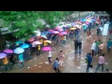 students march with umbrella