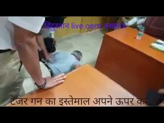 UP DGP taking a demo Taser shot on himself