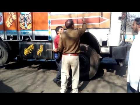 truck driver badly beaten by police in dhanbad