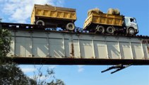 Large Truck Crosses Lofty Narrow Bridge