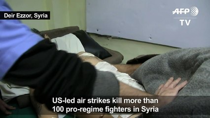 Pro-Syrian regime fighters treated at a Deir Ezzor hospital