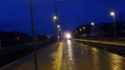 An electric locomotive attached at train