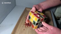 Man solves burning candle Rubik's Cube