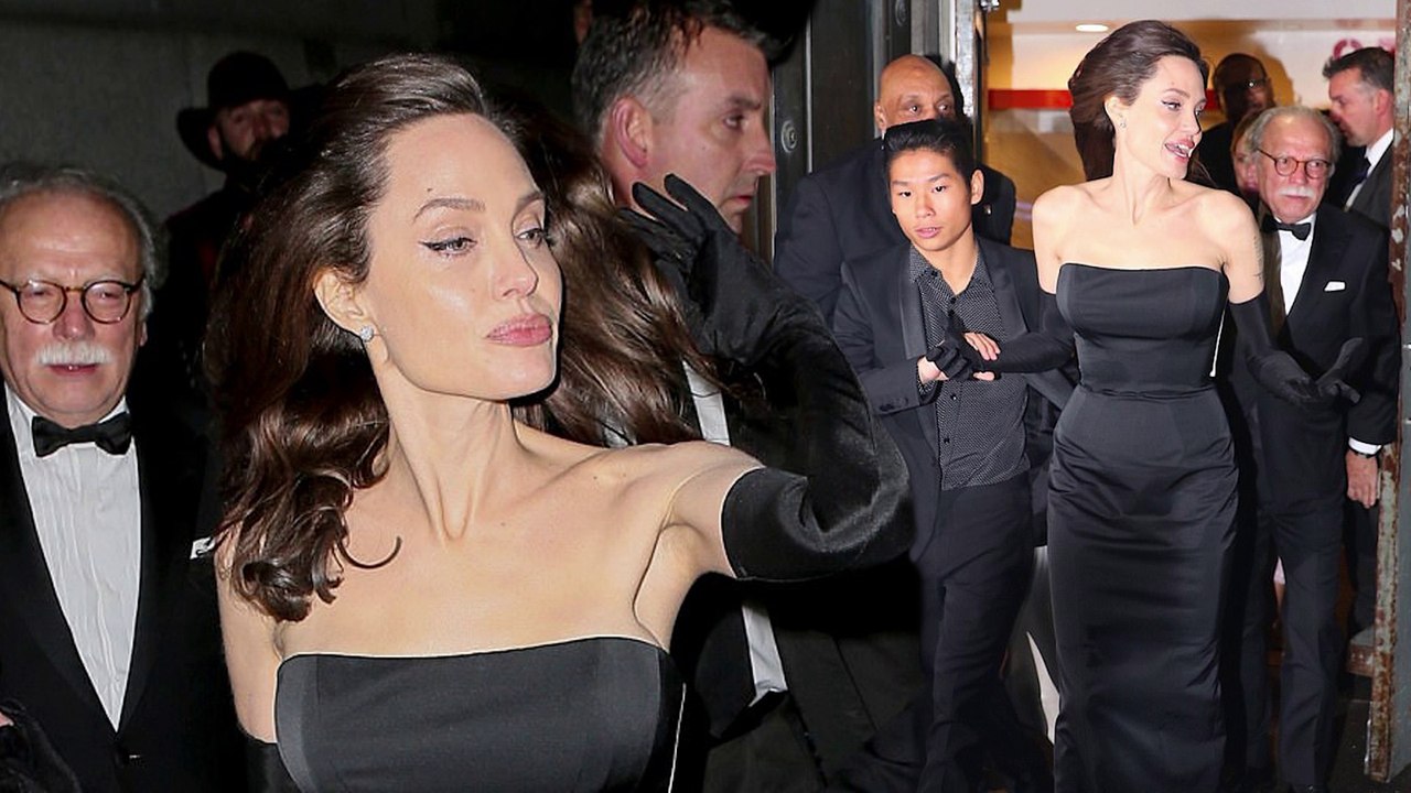Giving the cold shoulder! Angelina Jolie wows in black strapless gown after dinner with family in chilly New York City