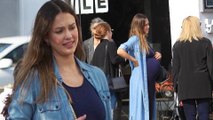 Any day now! Pregnant Jessica Alba showcases bump in clingy navy dress for family outing... after revealing she sees a therapist
