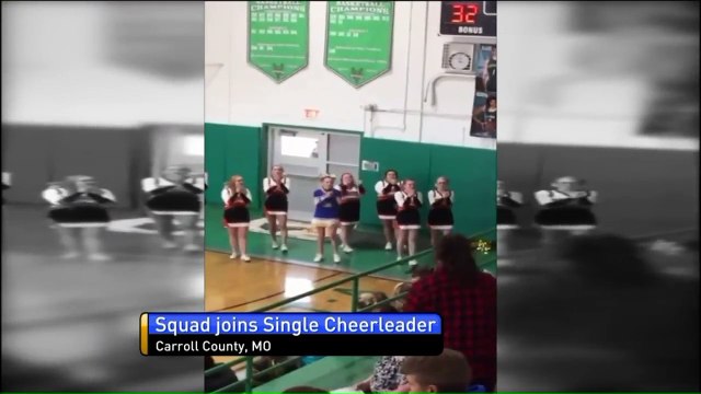 Cheerleading Squad Joins Teen From Opposing School Who Was Cheering Alone