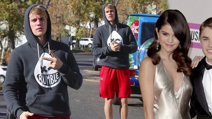 Justin Bieber flashes peace sign while out in Los Angeles... amid claims 'tumultuous' relationship with Selena Gomez has landed them in therapy.
