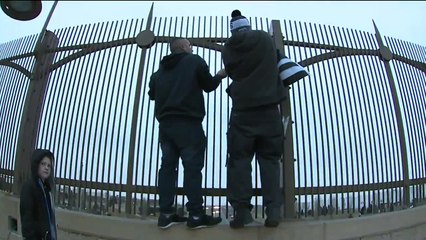 Men Hang Flags Throughout Denver in Honor of Slain Deputies