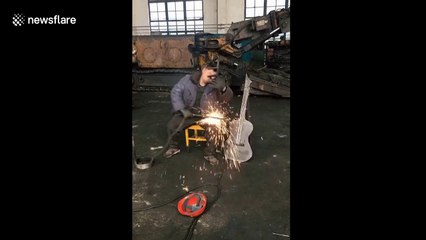 Man plays steel-made Chinese violin