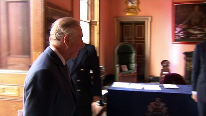 Harry greets Charles at conference