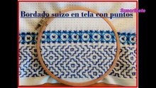 Bordado suizo sobre tela con puntos.