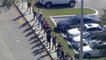 News footage shows kids walking out after Florida school shooting