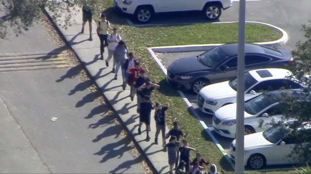 News footage shows kids walking out after Florida school shooting