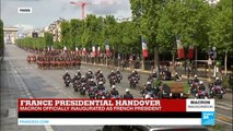French President Emmanuel Macron parades on Champs-Elysées Avenue