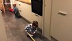 Toddler prepares for Winter Olympics curling in kitchen