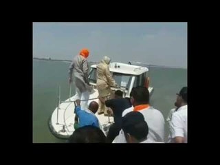 bjp mp throws plastic bottles in the ganga river