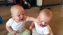 Twin baby girls fight over pacifier ( 360 X 640 )