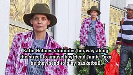 Katie Holmes shimmies her way along the street to amuse boyfriend Jamie Foxx as they head to play basketball.