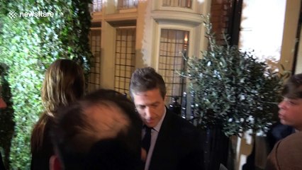 Cameraman falls over while filming Hugh Grant at pre-Bafta Awards party