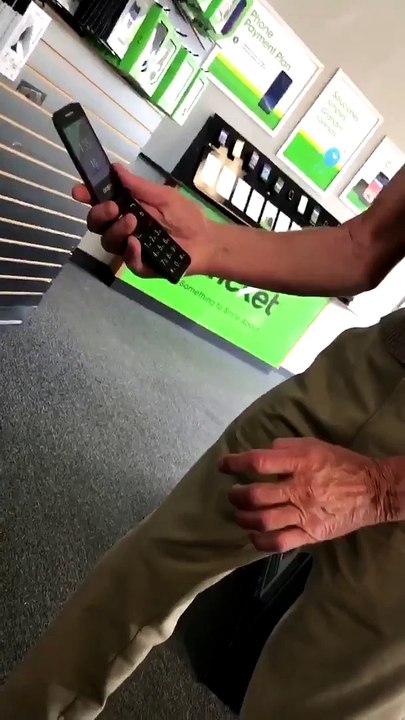 Elderly Man Learns How to Use Phone