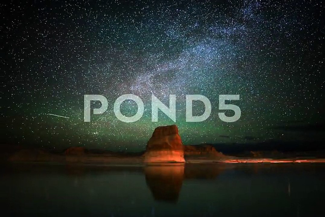 6K Astrophotography Time Lapse of Star Trails & Lone Rock over Lake -Full Frame- ~ Footage #40975563