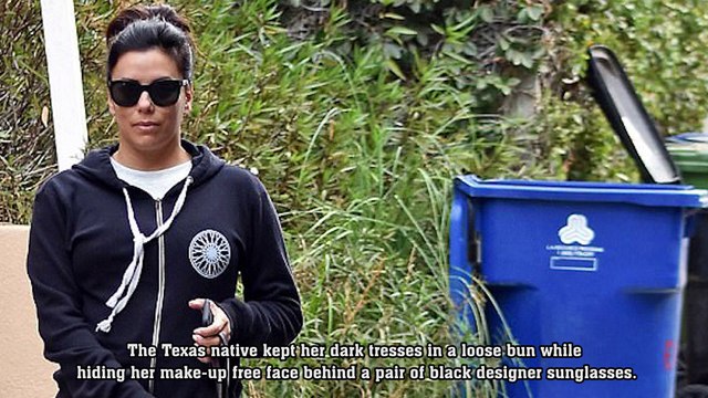 Puppy love! Pregnant Eva Longoria covers up bump in sporty sweatshirt as she walks dog... before leading protest march at Golden Globes.