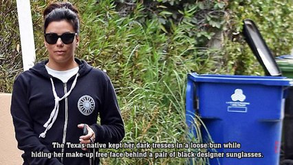 Puppy love! Pregnant Eva Longoria covers up bump in sporty sweatshirt as she walks dog... before leading protest march at Golden Globes.