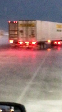 Wind Whips Trailer into Passing Truck