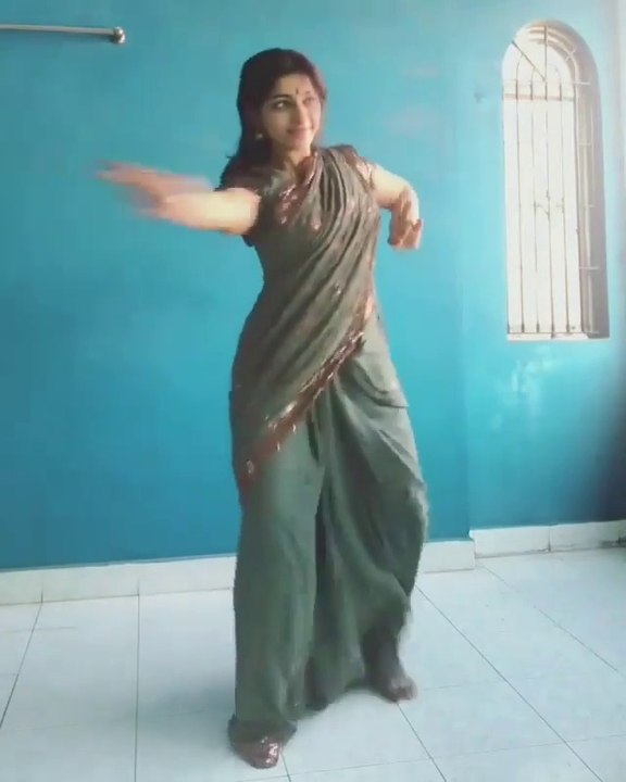 Cute Indian Lady dancing.
