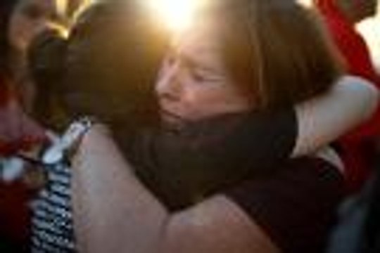 Outrage, tears at vigil for Florida shooting victims