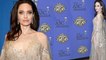Angelina Jolie is honored at the ASC Awards... as it's claimed her ex Brad Pitt 'has kept in touch with newly-split Jennifer Aniston'.