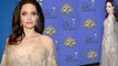 Angelina Jolie is honored at the ASC Awards... as it's claimed her ex Brad Pitt 'has kept in touch with newly-split Jennifer Aniston'.