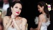 Angelina Jolie dazzles as she shows off tattoos at Critics' Choice Awards... after insider nixes romance rumors and says she won't date for a while.