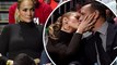 Keep your eye on the ball! Jennifer Lopez steals a kiss from Alex Rodriguez as they sit courtside at college basketball game in Miami.