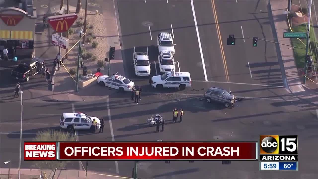 Two officers, woman hurt after Phoenix crash